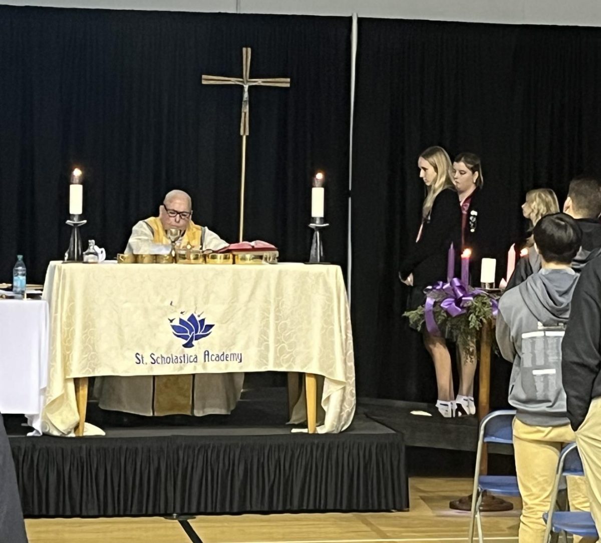 Msgr. Frank prepares to share the Eucharist