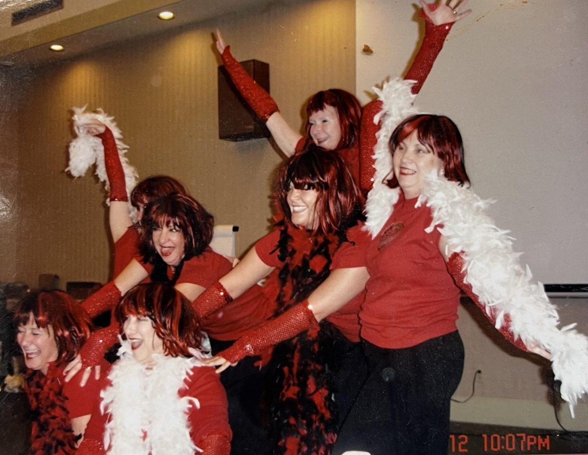 Mrs. Pettavino performing a dance with her coworkers at SSA's Senior Retreat in 2006. She says this is one of her favorite memories from her time at SSA.